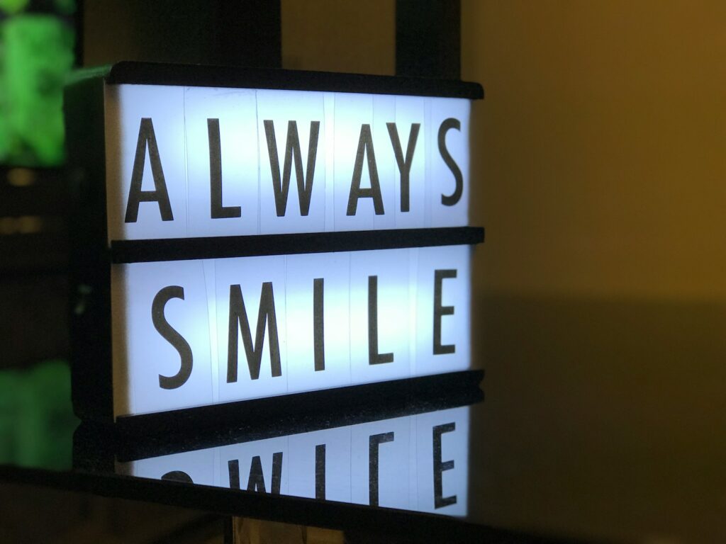 turned on Always Smile LED signage at dental office