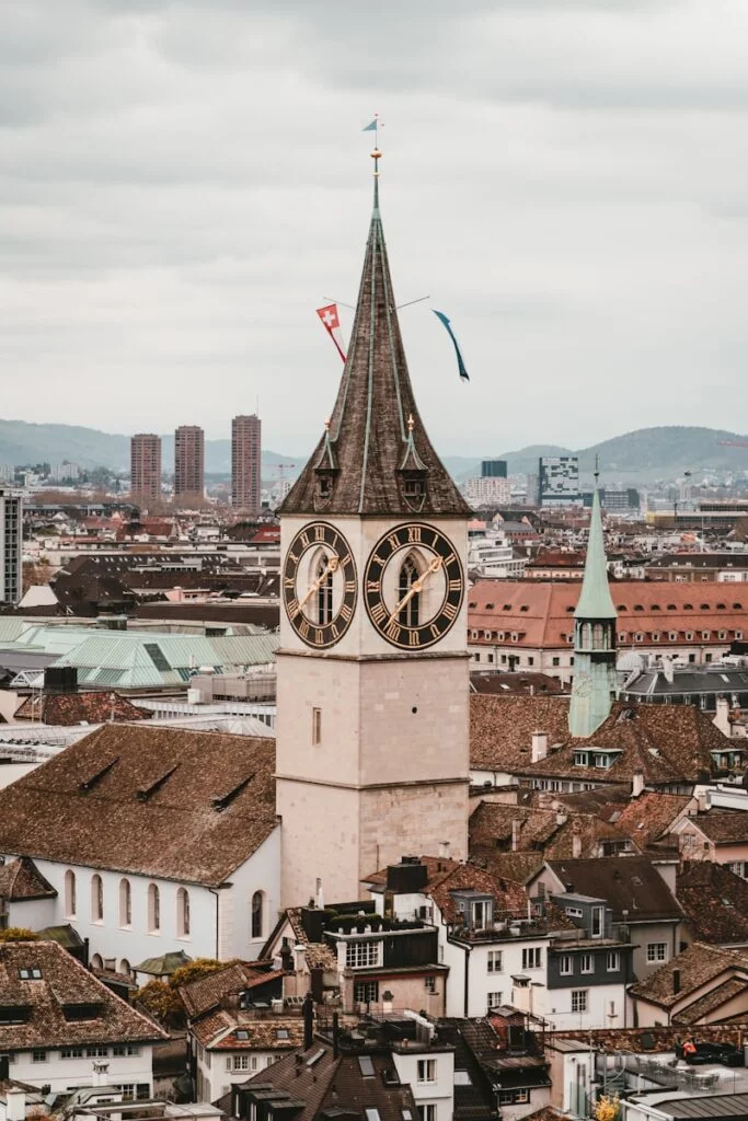 A scenic view of a Swiss city with pinpoint markers indicating various businesses, symbolizing local SEO efforts